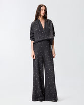 Jeans wide leg in denim scuro con occhielli - | Pinko