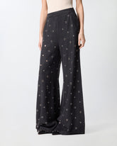 Jeans wide leg in denim scuro con occhielli - | Pinko