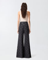 Jeans wide leg in denim scuro con occhielli - | Pinko