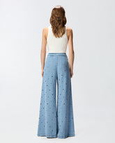 Jeans in denim con occhielli - | Pinko