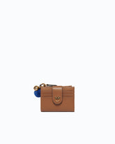 Portefeuille multifonction en cuir avec pompon - | Pinko