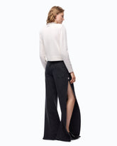 Jeans wide leg con spacchi laterali - | Pinko