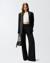 Pantaloni in denim con banda laterale in pizzo -  | Pinko