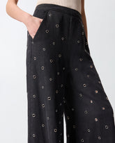 Jeans wide leg in denim scuro con occhielli -  | Pinko