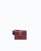 Portefeuille multifonction en cuir avec pompon -  | Pinko